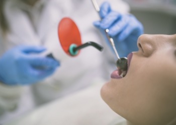 Patient receiving dental bonding treatment