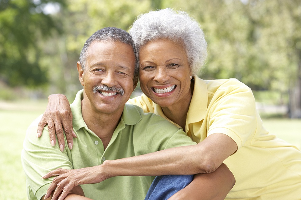 Smiling older man and woman outdoors