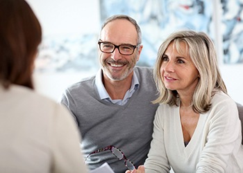 couple at a dental implant consultation 