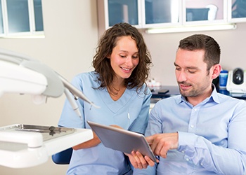 Patient in Midland talking to dentist about oral conscious sedation