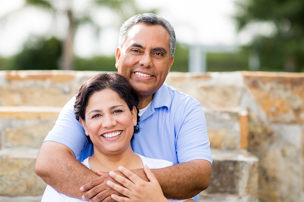 Smiling older man and woman outdoors