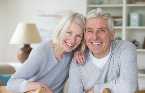 Older man and woman smiling together