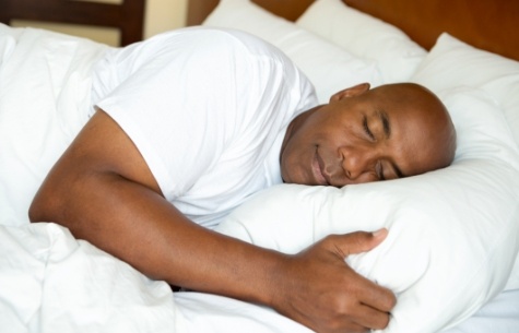 Man sleeping soundly in bed