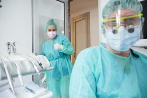 dentist in Midland and dental hygienist wearing PPE 