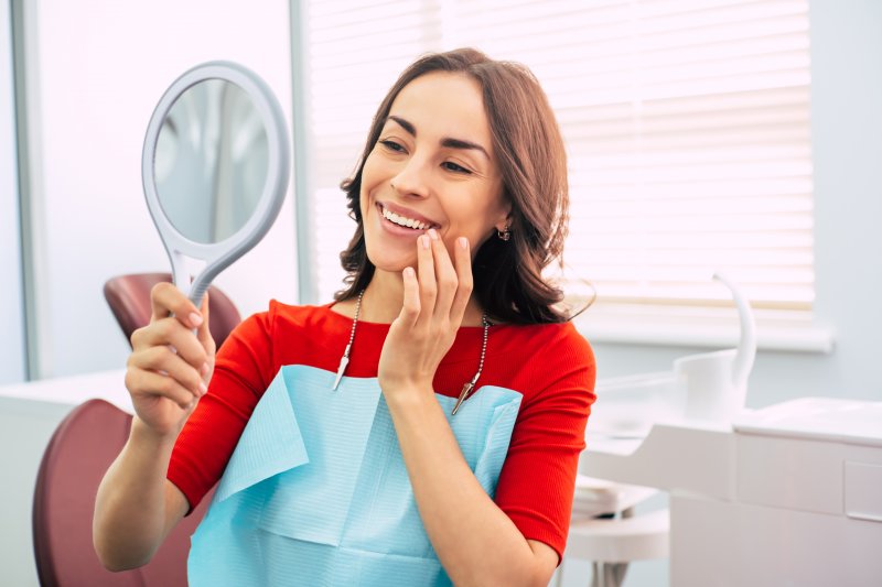 Woman smiling with dental implants