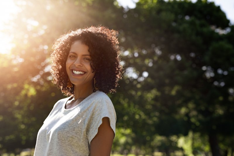 Woman smiling after teeth whitening