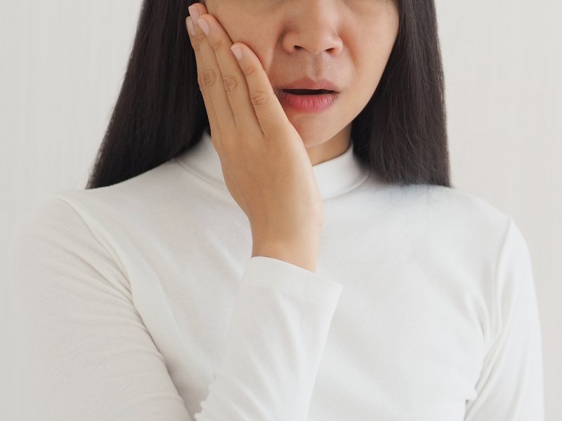 young woman with jaw pain