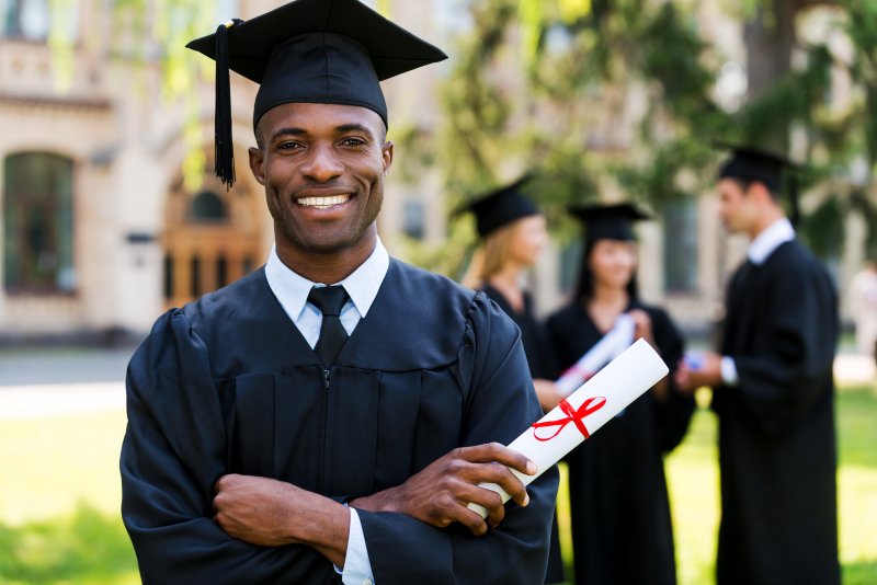 A closeup of a student celebrating hiscollege graduation