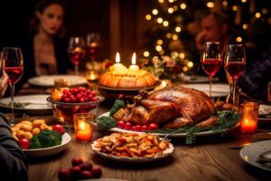 Thanksgiving meal on a table with people blurry in the background