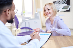 Patient talking to an administrator