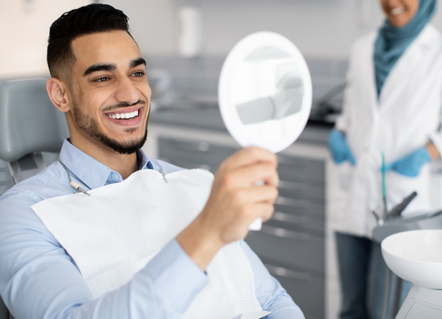 Man admiring new veneers